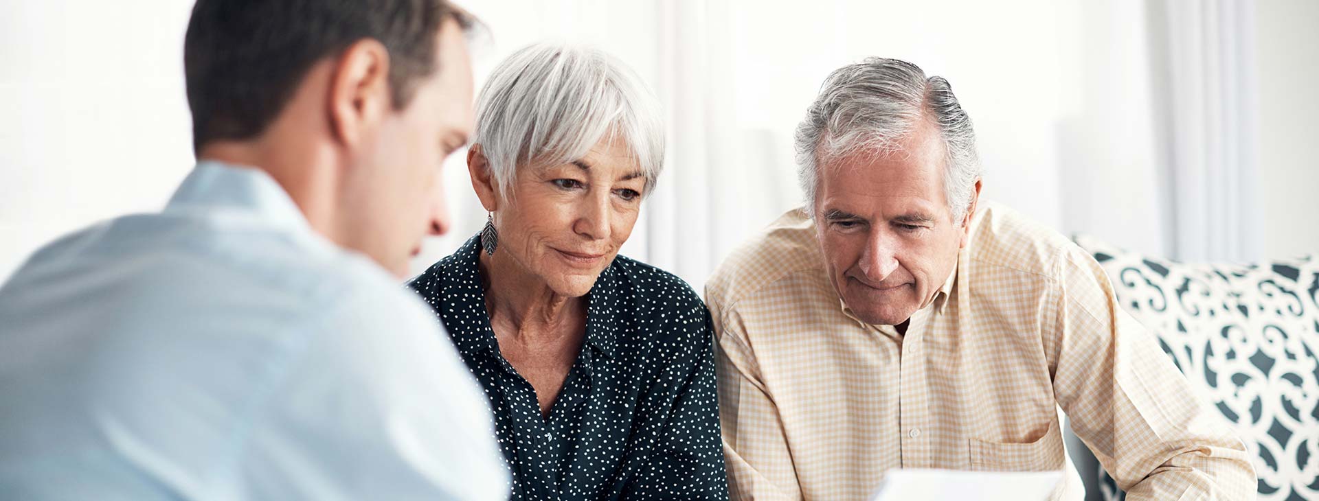 Mature couple discussing options with reputable kitchen company designer